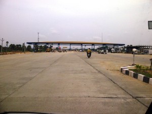 Toll plaza with expansion joints and joint filler boards